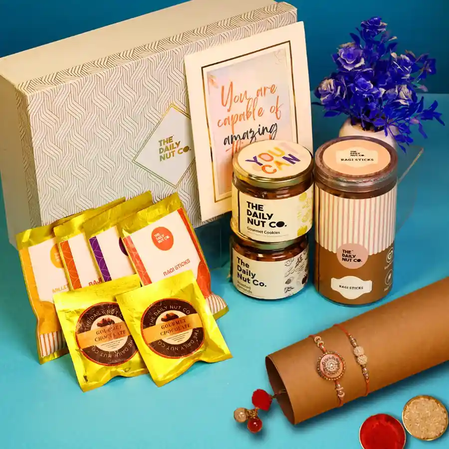 Ultimate Rakhi Treats Gift Surprise with assorted snacks and Rakhi card.
