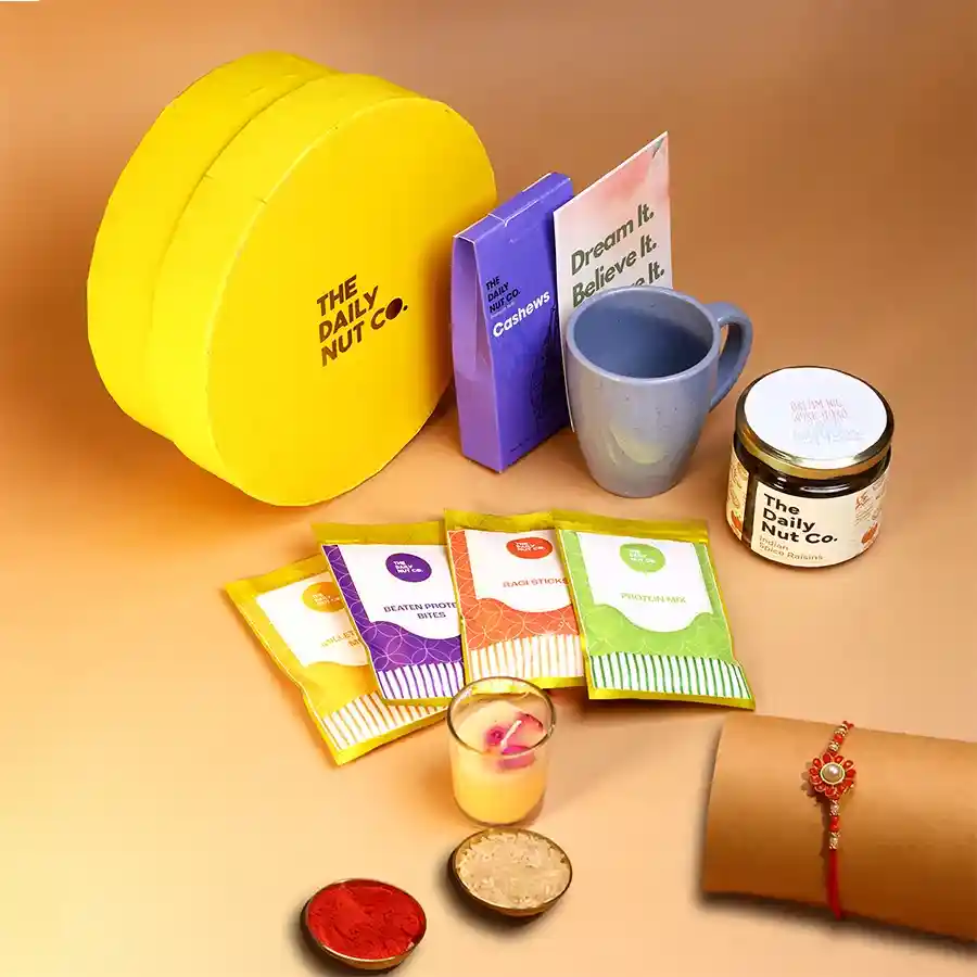 Rakhi Wellness Gift Hamper with wholesome snacks and an eco-friendly mug.