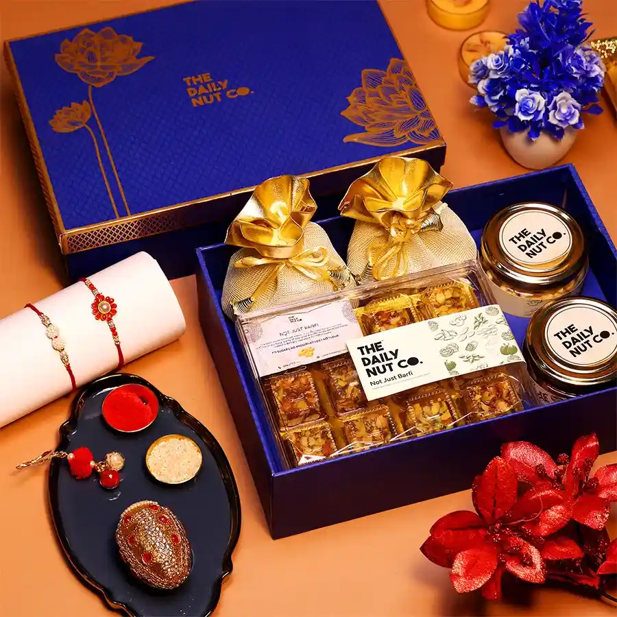 Festive Rakhi Special Celebration Gift with nuts, sweets, and savory snacks.