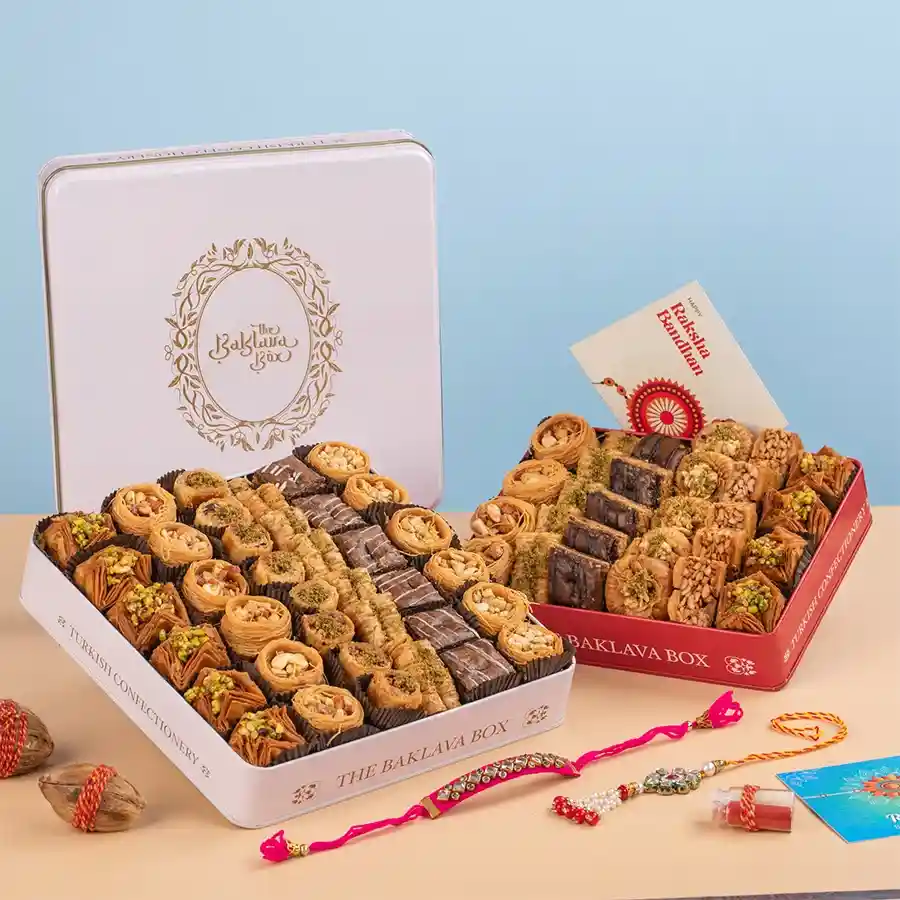 Elegant Rakhi & Baklava Ensemble featuring designer Rakhis and assorted baklavas in beautifully designed tin boxes.