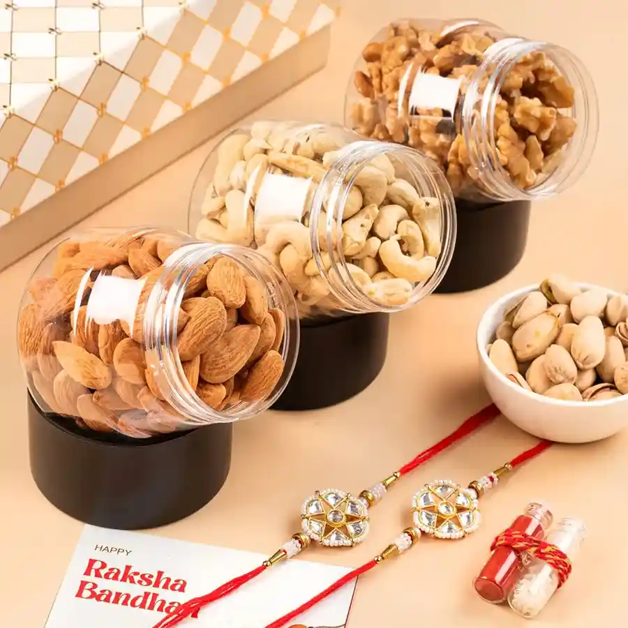Nuts & Rakhis Celebration Box featuring dry fruits, Rakhi sets, and a greeting card for festive celebrations.