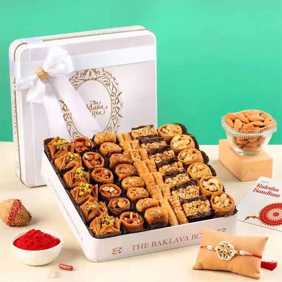 Sweet Harmony Rakhi and Baklava Set in elegant white tin.