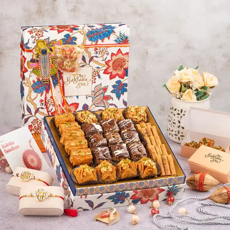 Rakhi Baklava Bliss Gift Box featuring assorted Baklava and two beautiful Rakhis wrapped in ribbon.