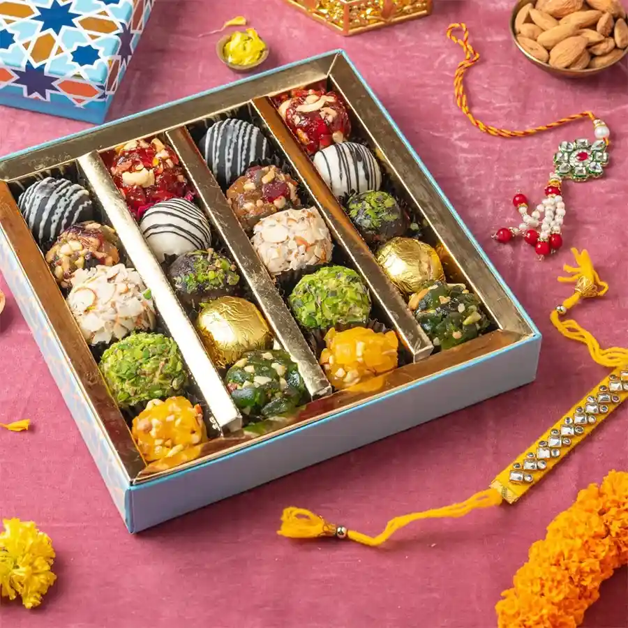 Fusion Sweets and Rakhi Harmony gift box featuring Indian fusion sweets and two beautifully crafted Rakhis.
