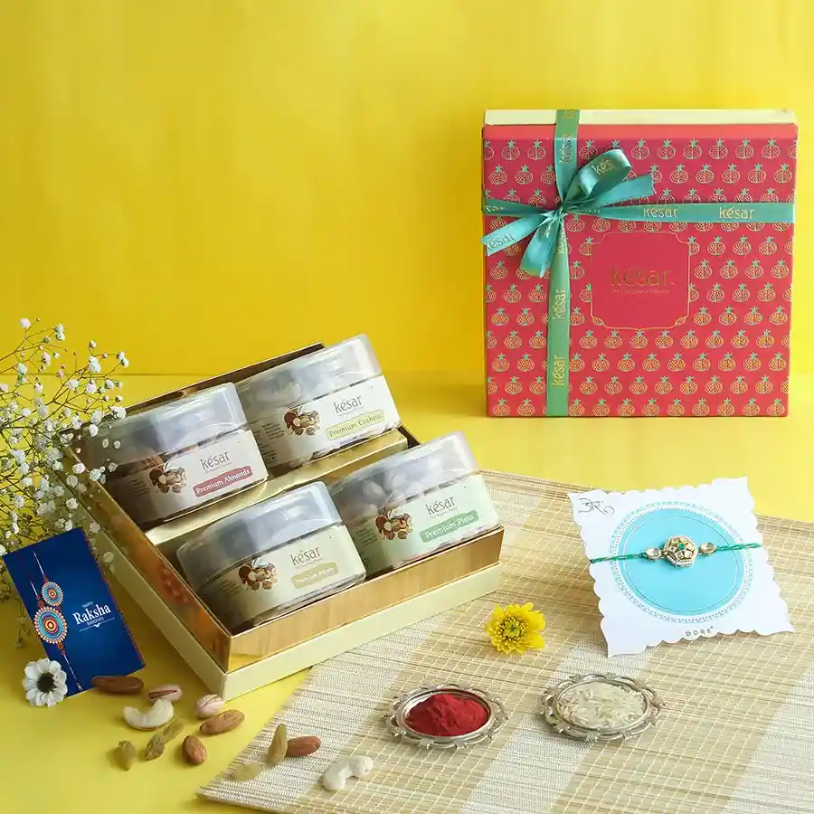 Nutty Indulgence Rakhi Gift Box with nuts and a Green Polki Rakhi.