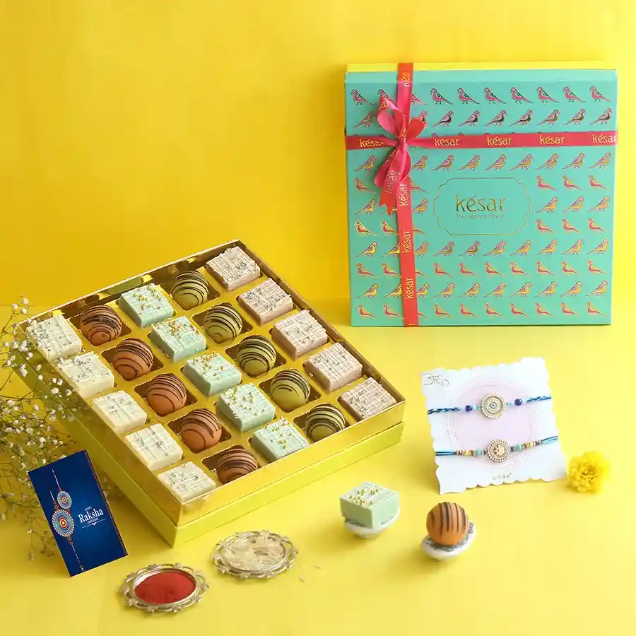 Stunning Rakhi & Sweet Serenity Box featuring blue rakhis and assorted sweets.