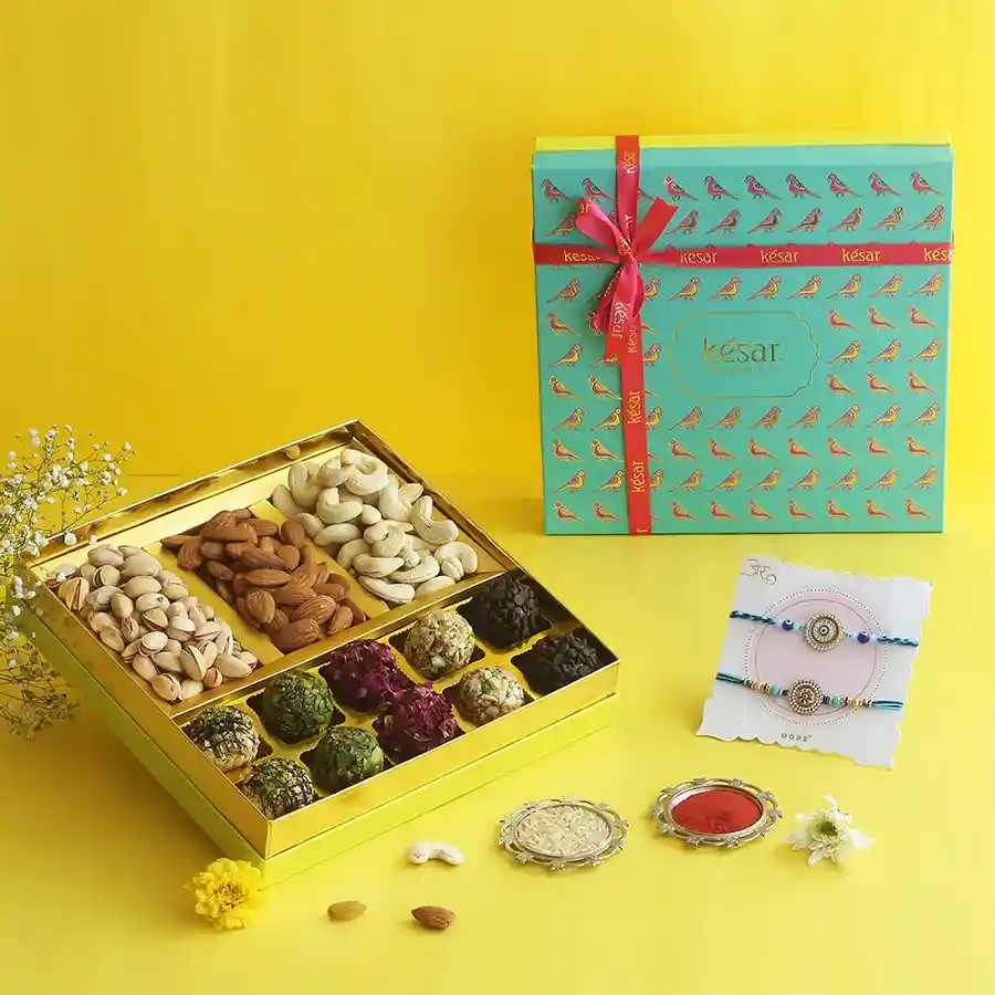Vibrant Rakhi & Nutty Laddoos Treat with assorted laddoos and luxury nuts.