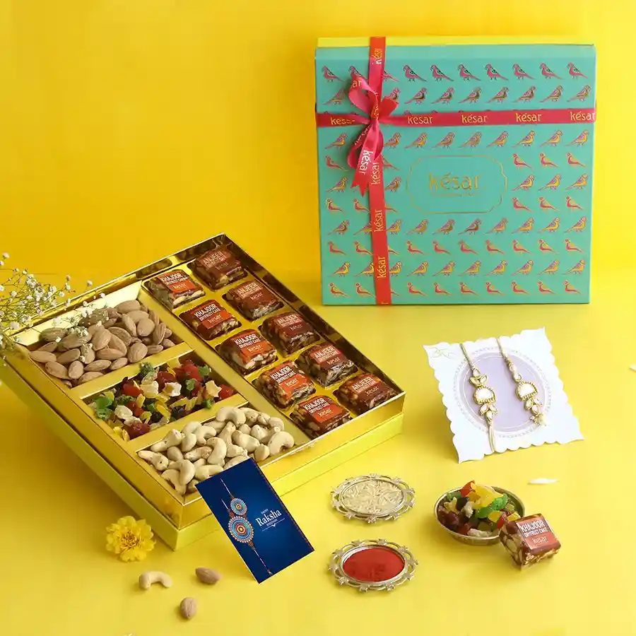 Delightful Rakhi Celebration Gift Box with healthy treats and beautiful Rakhi set.