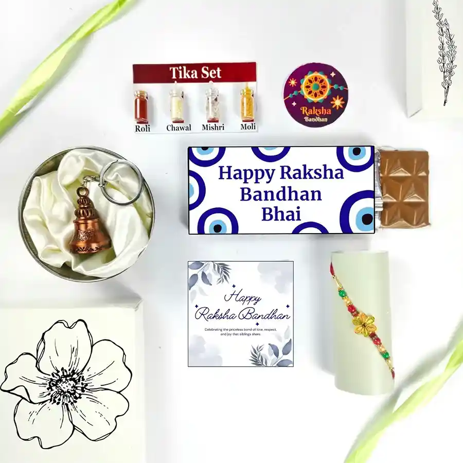 Enchanting Rakhi Celebration Gift including Rakhi, chocolate, Guardian Bell, greeting card, and Tika Set.