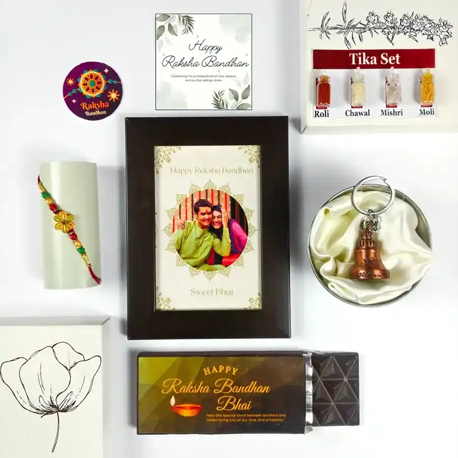 Heartfelt Rakhi Surprise Gift Hamper for brother with sweets, chocolate, a photo frame, and traditional Rakhi items.