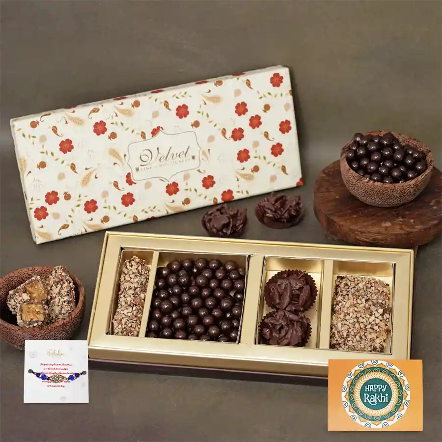 Evil Eye Rakhi accompanied by assorted crunchy almond treats and a greetings card, perfect for Raksha Bandhan celebration.