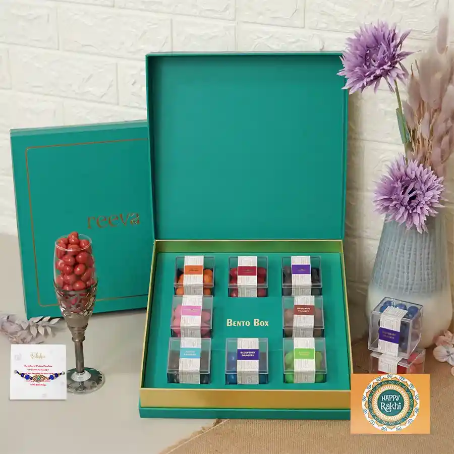 A colorful gift box featuring an assortment of dragees and an Evil Eye Rakhi for Rakhi celebrations.