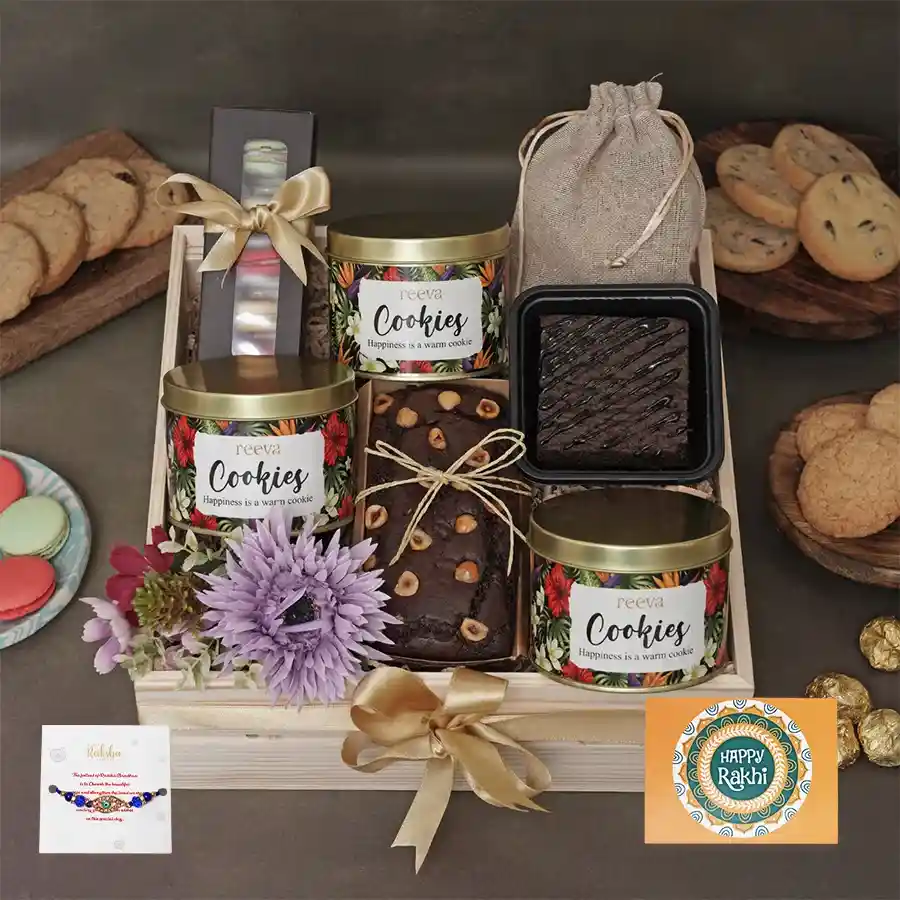 Exquisite Rakhi Treats Gift Box with cookies, a Hazelnut Loaf, and a Rakhi, perfect for family gatherings.