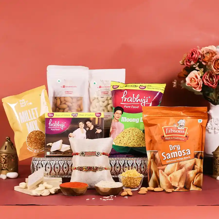 Sibling Connection : Rakhi Delight Set featuring two Rakhis and assorted snacks in a reusable gift box for Raksha Bandhan celebrations.