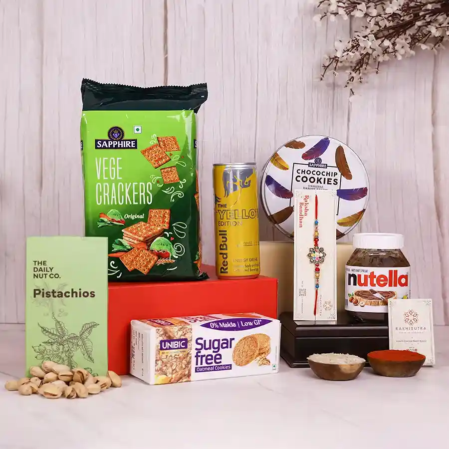 Rakhi Festive Treats Delight Hamper with snacks and a designer Rakhi.