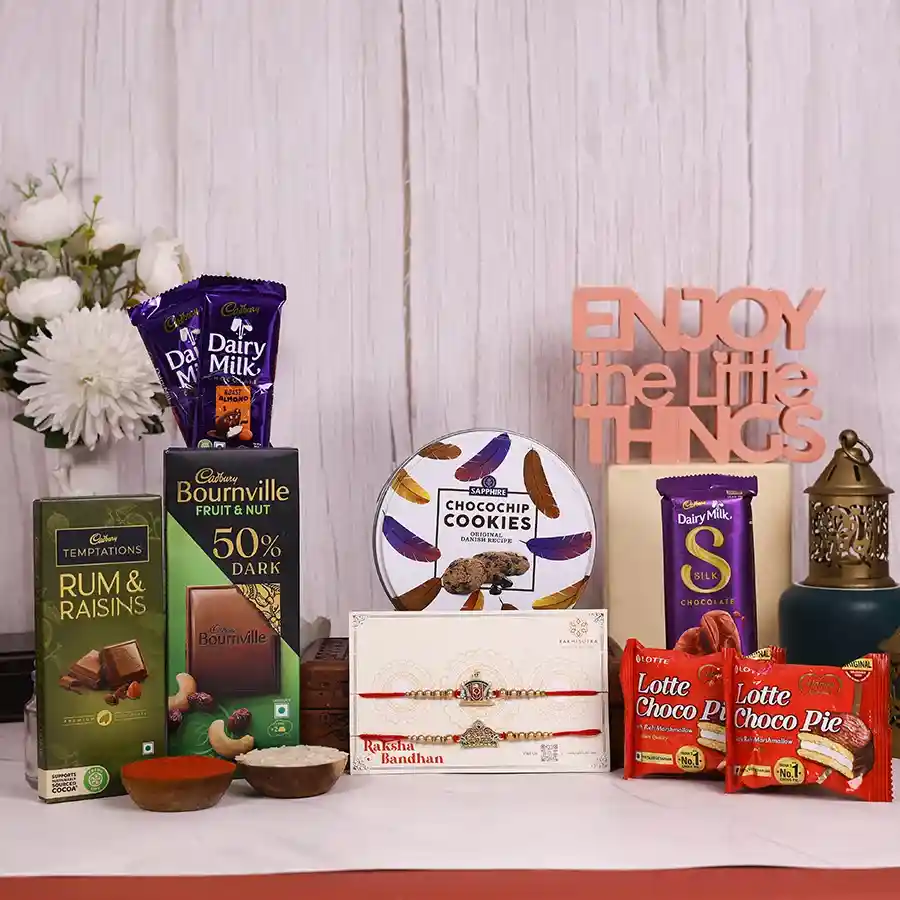 Rakhi Joyous Celebration Box with designer rakhi, assorted chocolates, cookies, and traditional tika essentials for Raksha Bandhan.