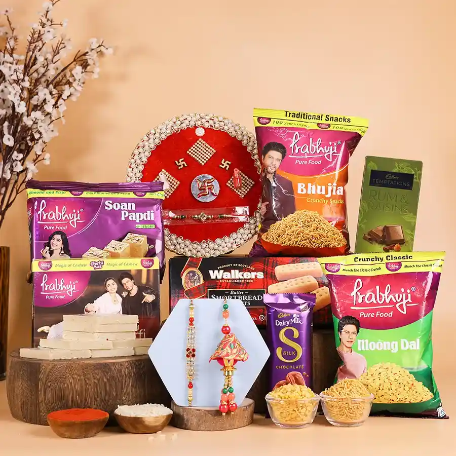 Royal Rakhi Siblings Treats Hamper featuring sweets, snacks, and a Rakhi set for Bhaiya and Bhabhi.