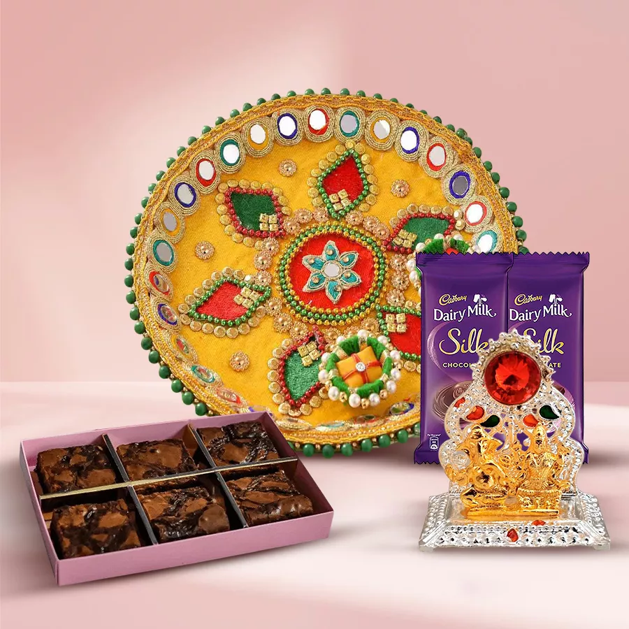 Brownie N Gifts package featuring a designer Pooja Thali, Cadbury Silk bars, dry brownies, and a Ganesh-Laxmi Mandap.