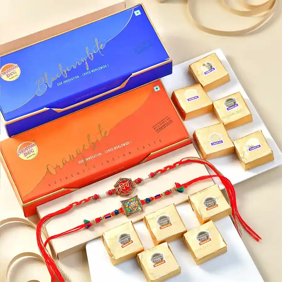 Spiritual Rakhi & Sweets Combo with fruity bites in a transparent gift bag.