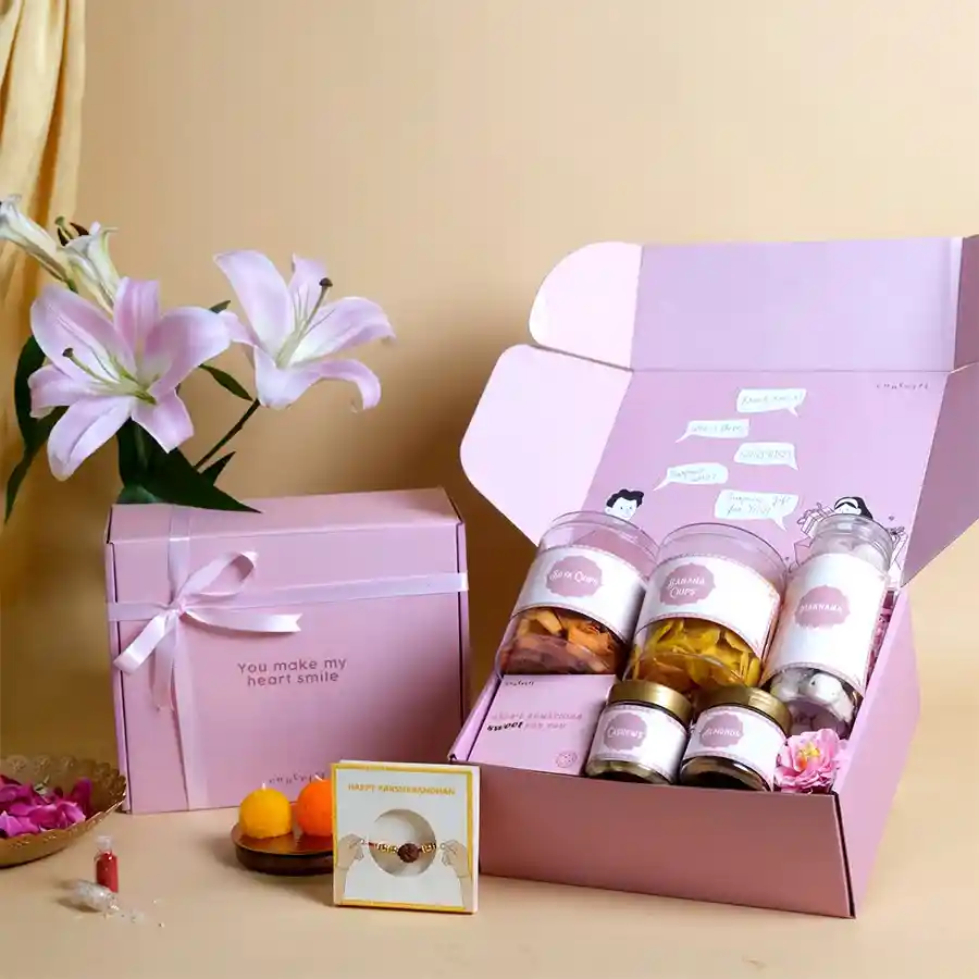 Savory & Sweet Rakhi Snack Collection with snacks and Rudraksha Rakhi.