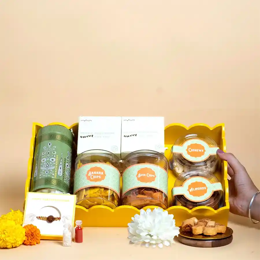 Festive Crunchy Rakhi Delight Tray with snacks and Rudraksha Rakhi.