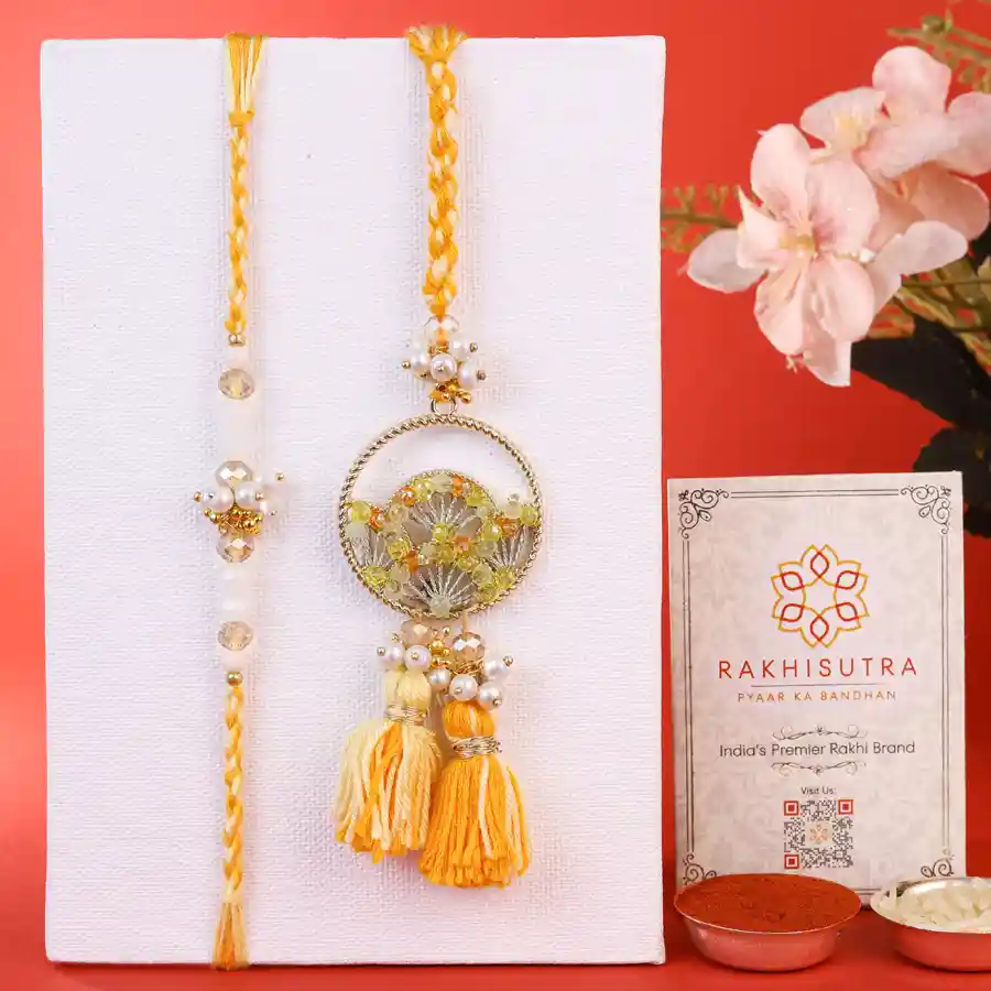 Delightful Bhaiya Bhabi Rakhi Duo with ritual items