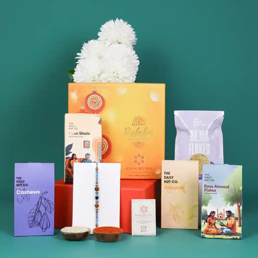 Thoughtful Evil Eye Rakhi alongside nutritious snacks