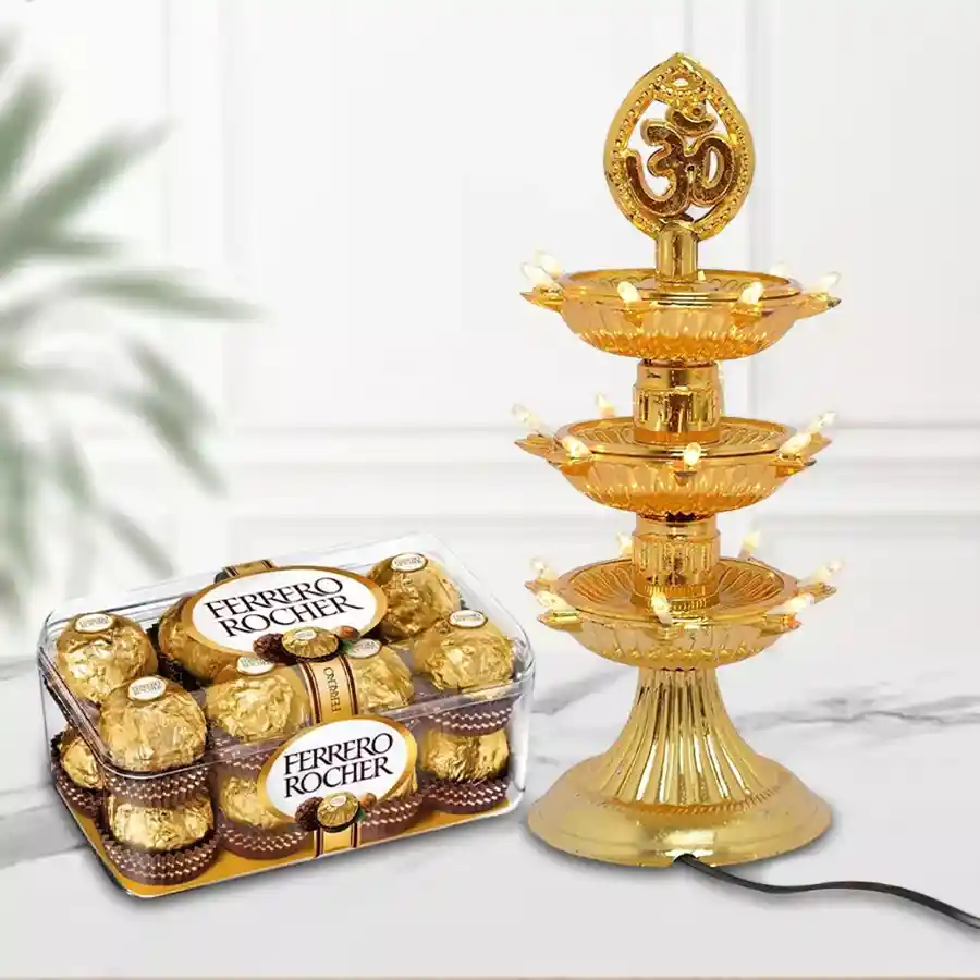 Reusable wooden gift box featuring 16 Ferrero Rocher chocolates and a 3-layer Diya LED lamp for Diwali celebrations.
