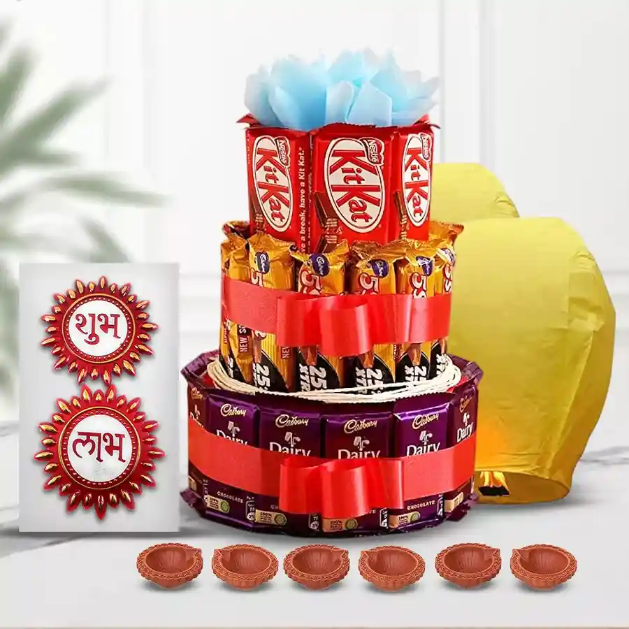 Diwali chocolate arrangement featuring Cadbury Dairy Milk, Five Stars, Nestle Kitkats, flying lanterns, mud diyas, and Subh Labh wall stickers.