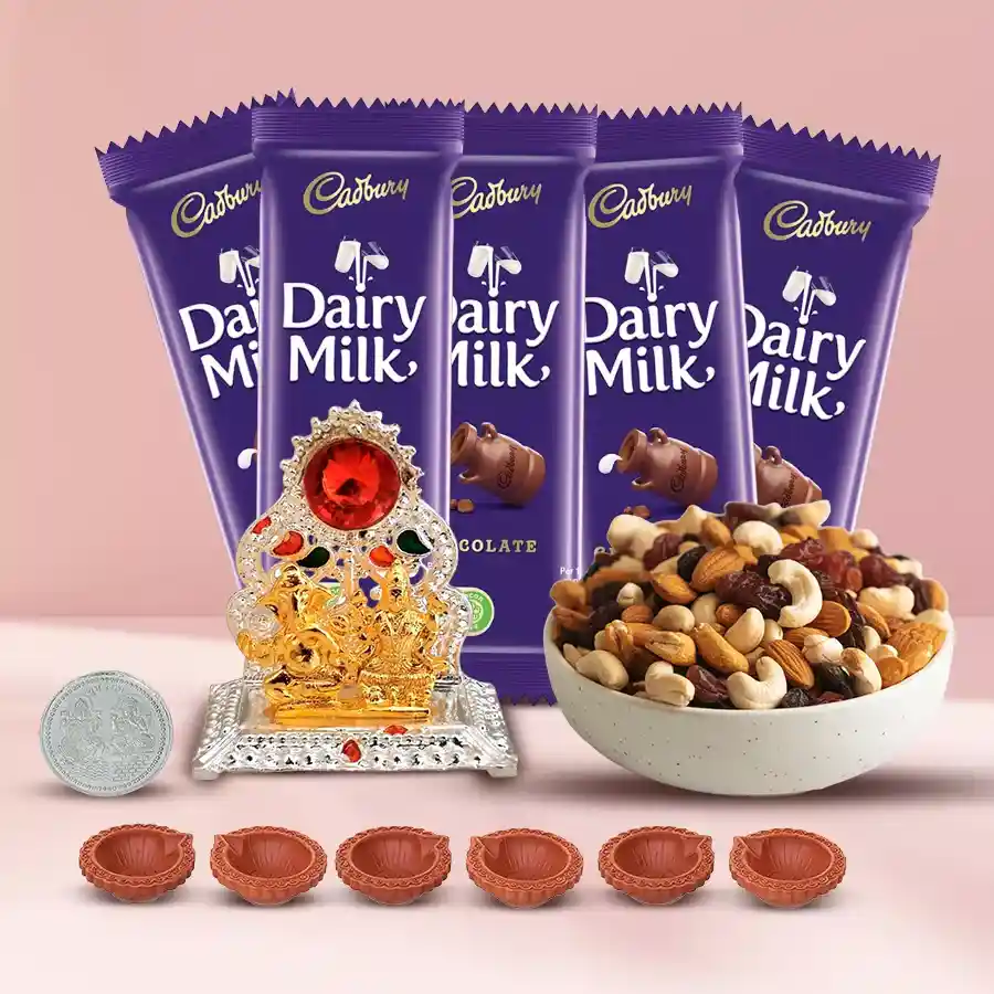 Marvelous Diwali gift hamper featuring Cadbury chocolates, premium dry fruits, an Antique Ganesh Laxmi Mandap, decorative mud diyas, and a silver-plated coin, all beautifully arranged in an elegant gift box.