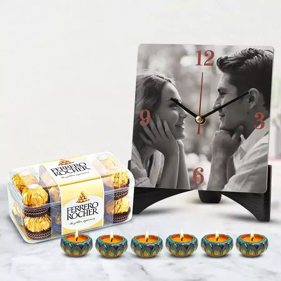 Personalized photo table clock with Ferrero Rocher chocolates and designer diyas for Diwali celebration