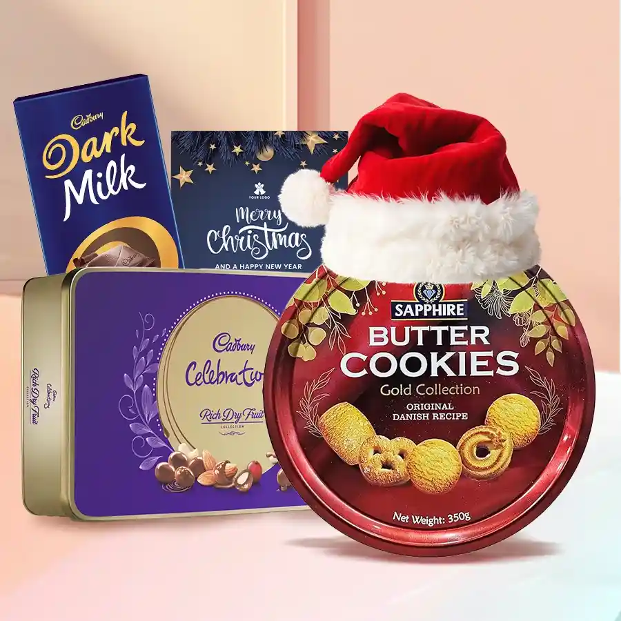 Marvelous Xmas Chocos N Cookies Gift Combo featuring a tin of Sapphire Butter Cookies, Cadbury Rich Dry Fruit collection, Cadbury Dairy Milk Dark Milk bar, Santa Claus cap, and a festive Xmas card.