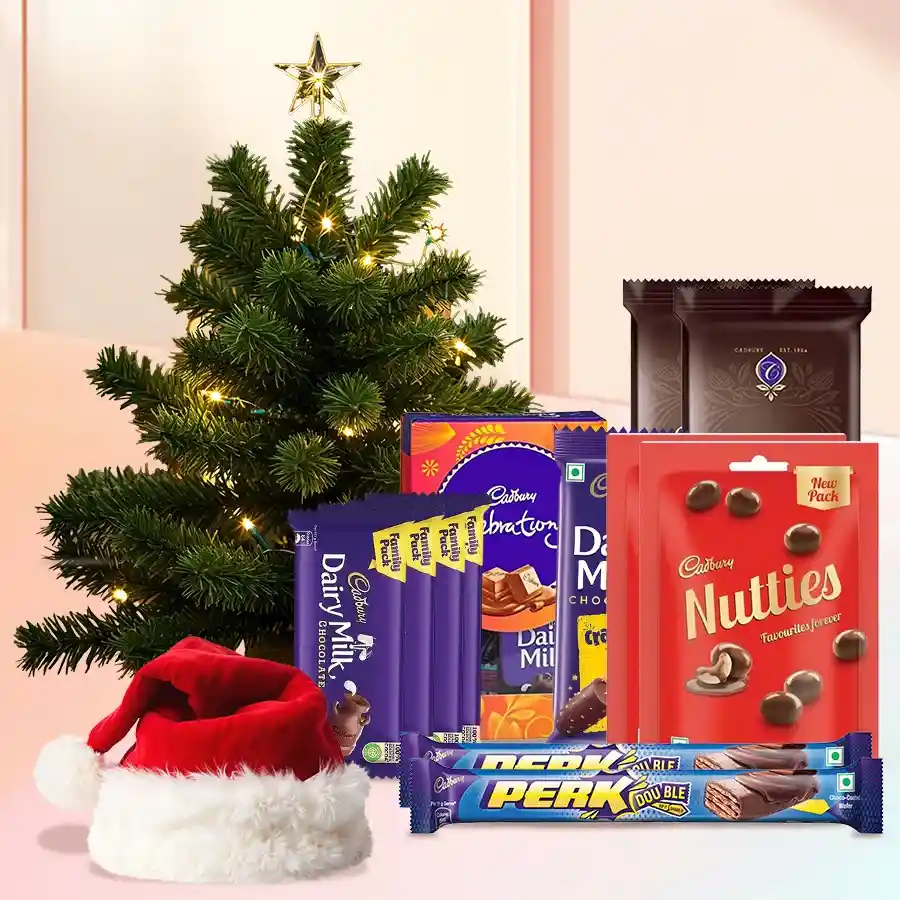 Wonderful Chocolates Gift Hamper featuring Cadbury chocolates, a 1-ft Christmas tree, and a Santa cap