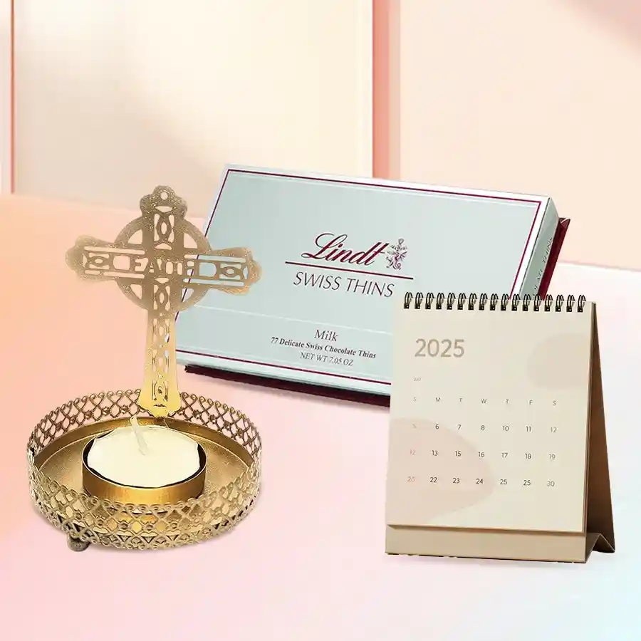 Lindt Swiss Thins Milk Chocolates with a stylish Cross Tea Light Holder and Desk Calendar set on a desk