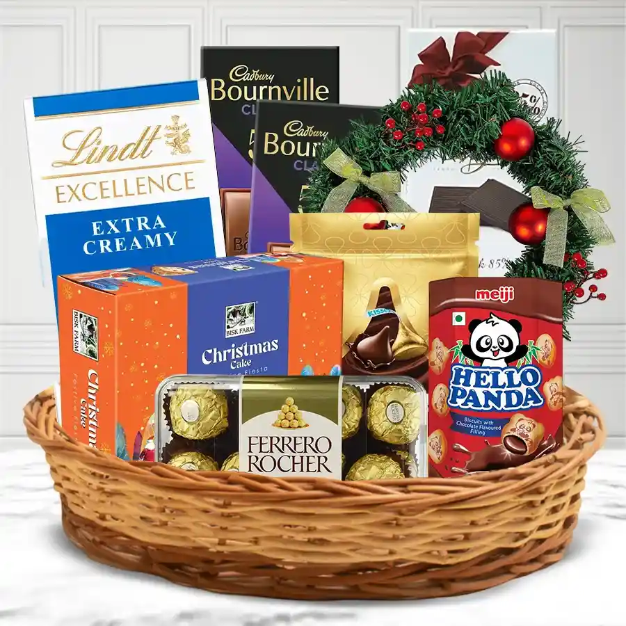 Luscious Chocolates Gift Basket featuring various chocolate brands and a decorative wreath in a cane basket