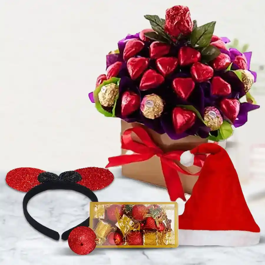 Heart-shaped arrangement featuring 22 handmade decorations and 8 Ferrero Rocher chocolates, topped with a Santa Claus cap and a stylish hairband, ideal for festive gifting.