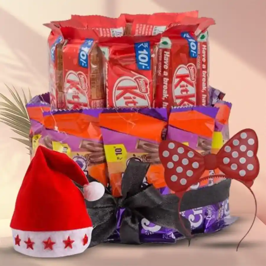Double-deck chocolate arrangement featuring Nestle KitKats and Cadbury Crispellos, accompanied by an LED Santa Claus Cap and sparkling LED Hairband.