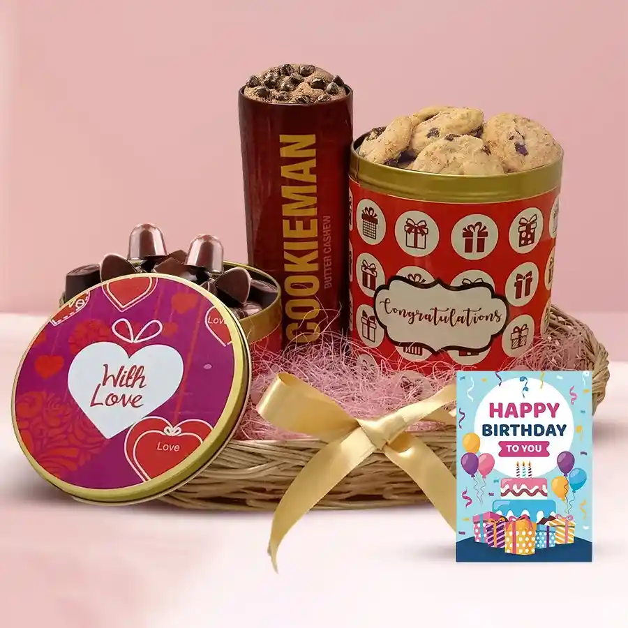 Assorted cookies and handmade chocolates in a decorative can with a birthday card