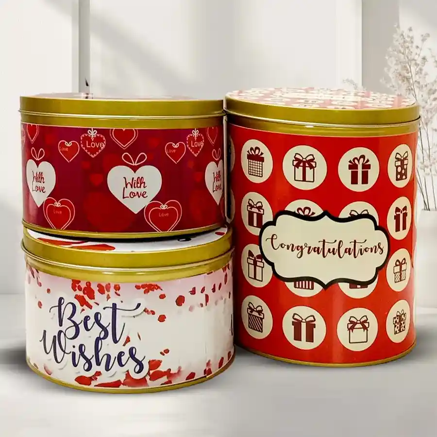 Exclusive Christmas Cookies Combo featuring assorted chocolates, handmade milk chocolates, and Cookie Mans Chocochip Cookies, all beautifully packaged in festive tin boxes.