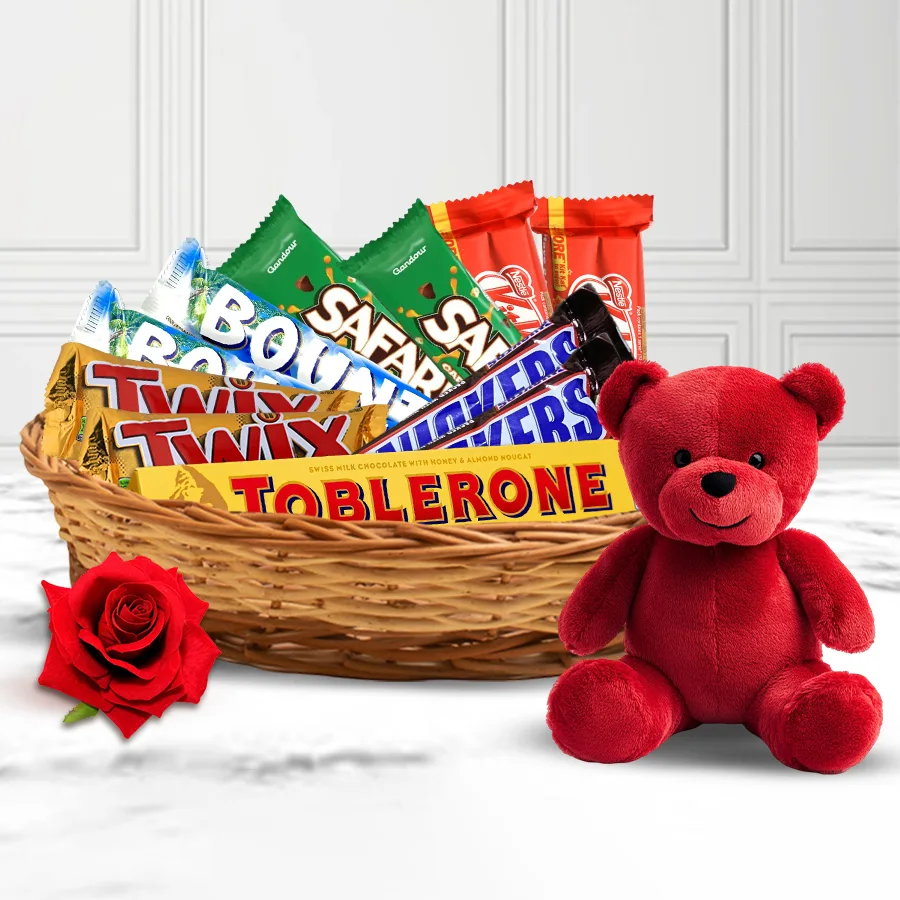 Irresistible Chocolate Assortments Gift Basket featuring an array of chocolates, a cuddly red teddy bear, and a beautiful red velvet rose