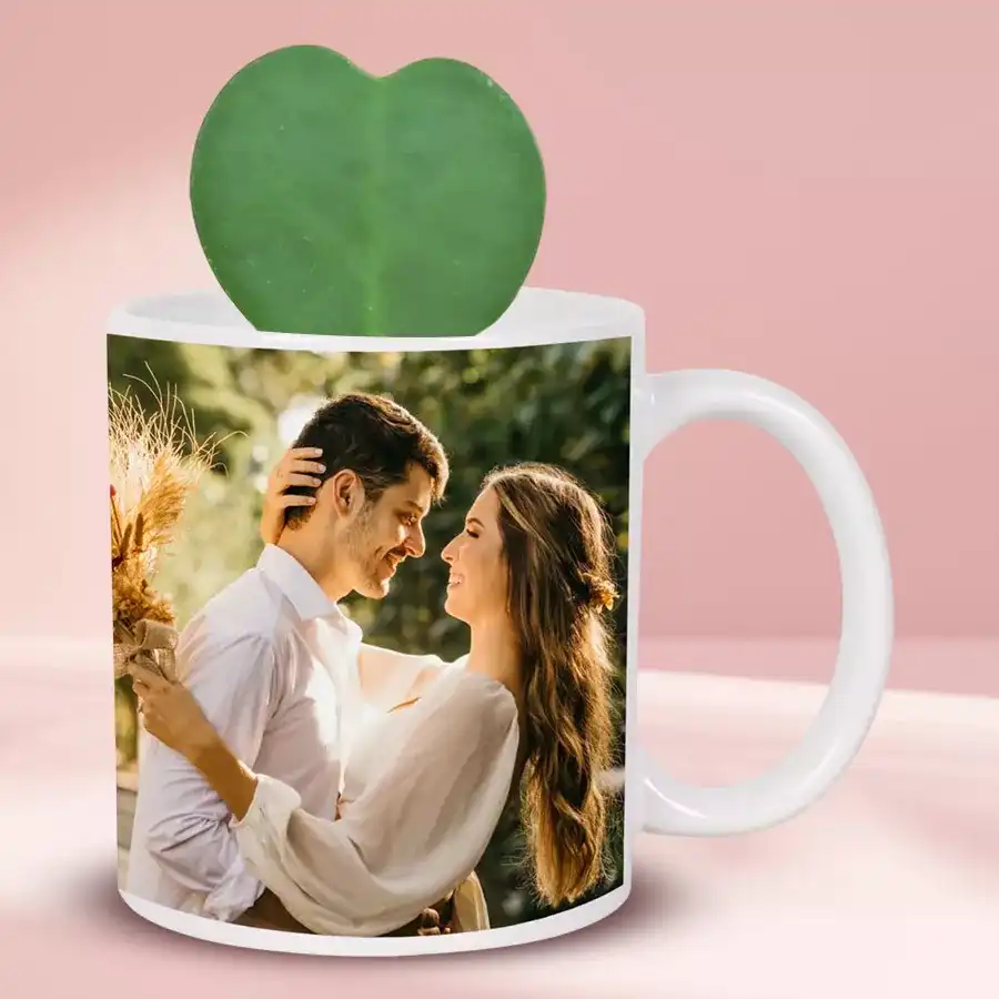 Hoya Heart Plant in a personalized coffee mug with a vibrant green heart-shaped leaf