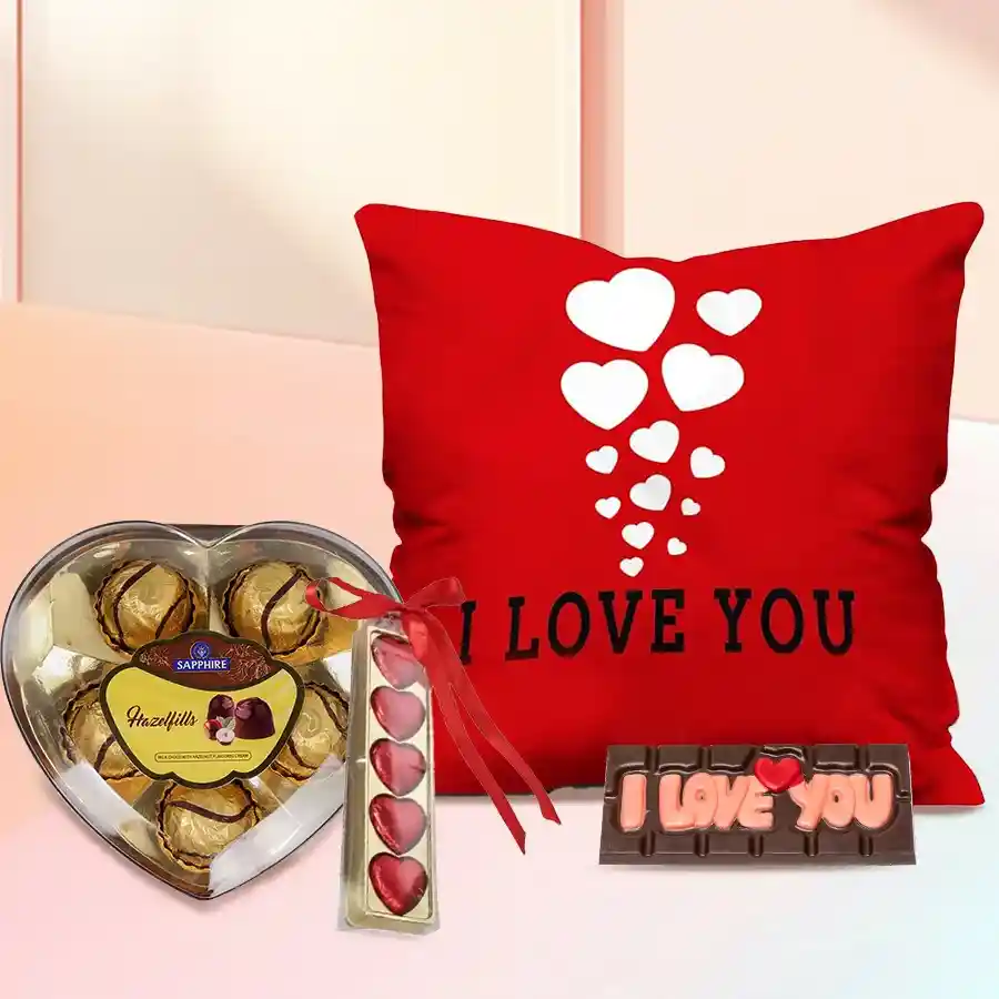 Personalized gift combo featuring a velvet cushion, sapphire chocolates, SMS chocolates, and heart-shaped chocolates for a girlfriend.
