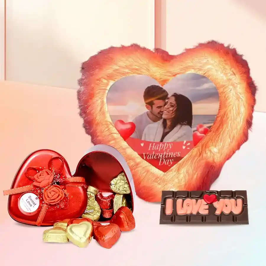 Personalized LED heart-shaped cushion with fur texture, accompanied by a tin box of 11 handmade chocolates, including a special "I Love You" chocolate.