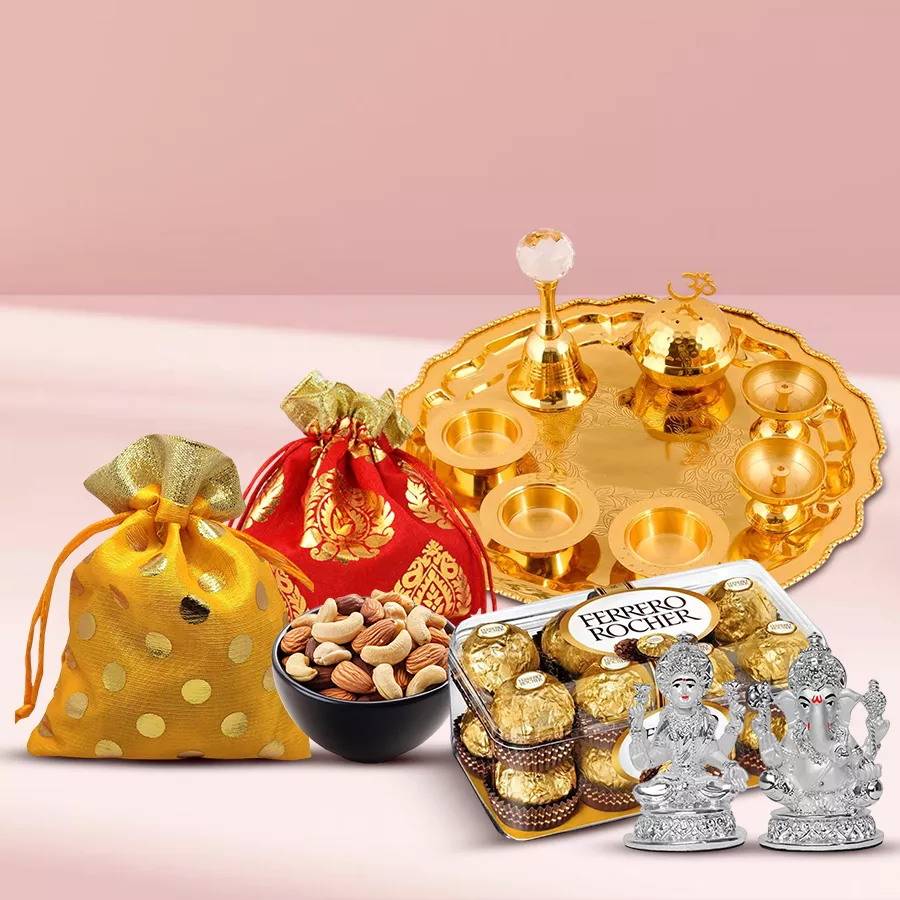 Crunchy Ferrero Rocher N Dry Fruits Delight gift set featuring a Lakshmi Ganesh idol, gold-plated German silver thali, potlis of cashews and almonds, and a pack of 16 Ferrero Rocher chocolates.
