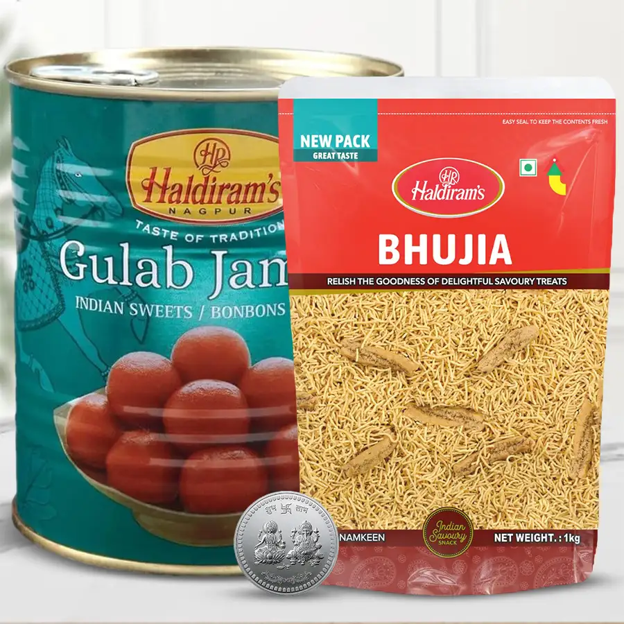 Finest Haldiram Bhujiya, Haldiram Gulabjamun, and a Ganesh Laxmi coin in a festive gift pack for Diwali.