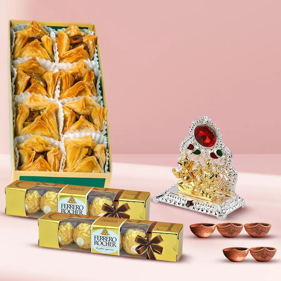 Lovely Pyramid Baklawa gift set with Ferrero Rocher chocolates, Ganesh Laxmi Mandap, and five decorative diyas for Diwali celebrations.