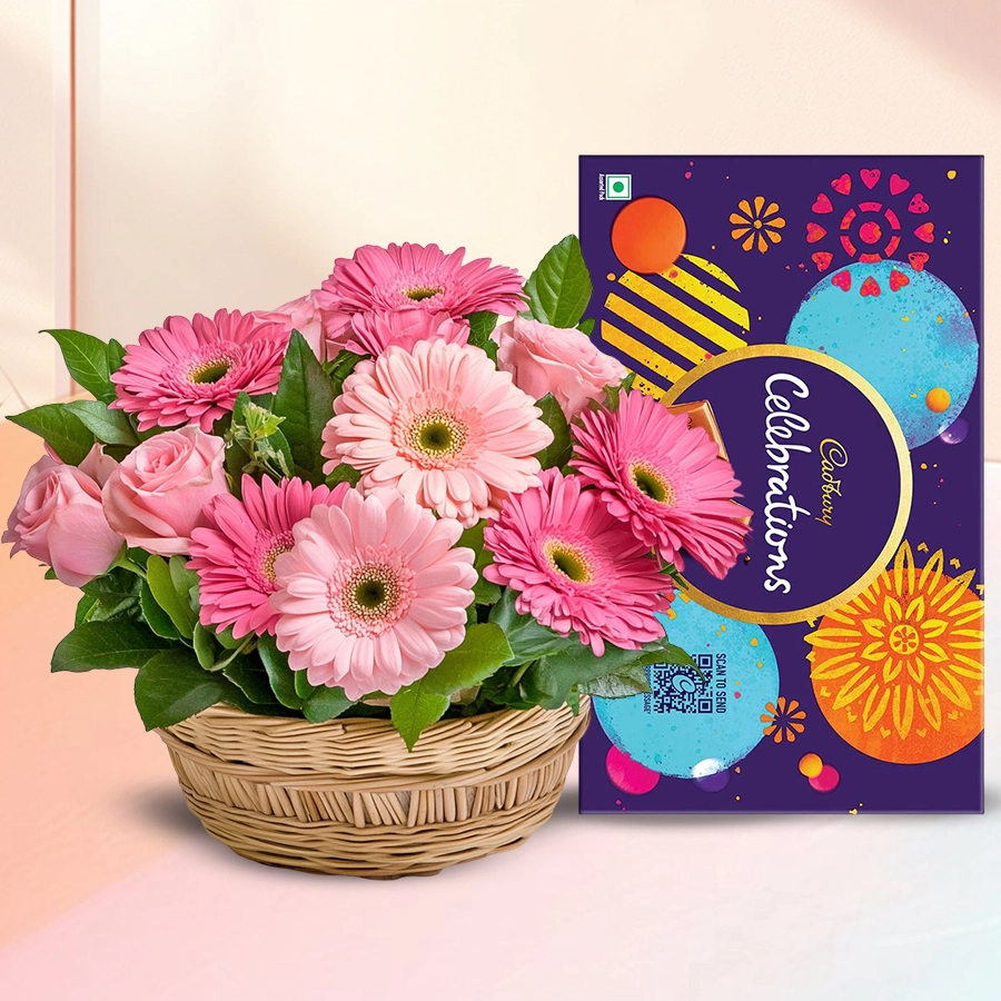 An arrangement of 10 pink roses and 10 gerberas alongside a Cadbury Celebration Pack.