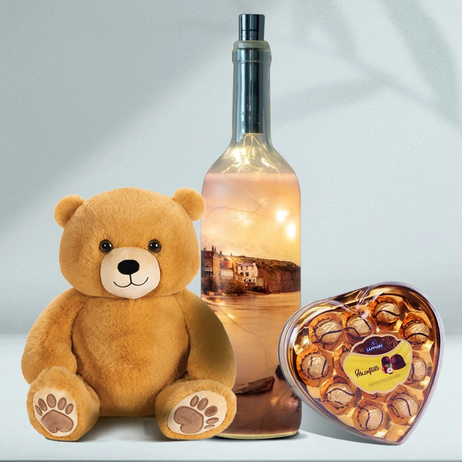 Bottle lamp, 6-inch teddy bear, and heart-shaped chocolate box arranged together for Valentine's Day gift.