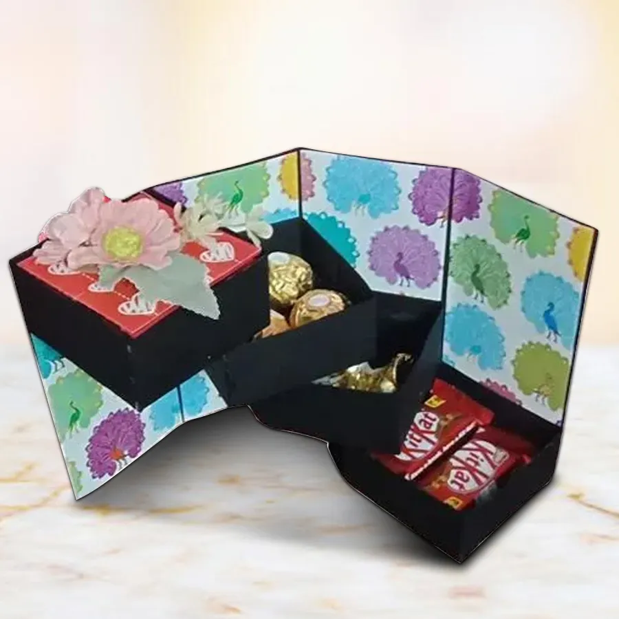 Dazzling multi-layer handmade stepper box filled with mixed chocolates including Ferrero Rocher, KitKat, and Hershey's Kisses