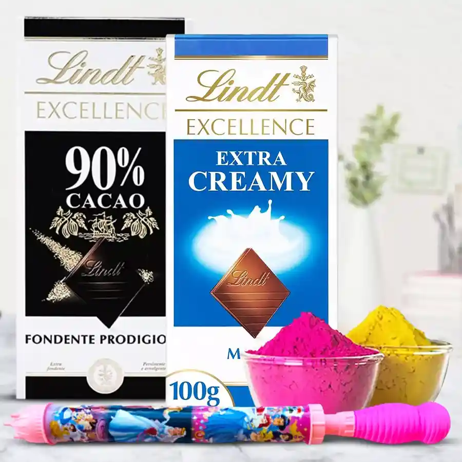 Alluring Holi gift set featuring two Lindt chocolate bars, a colorful pichkari, and herbal gulal pack on a festive background